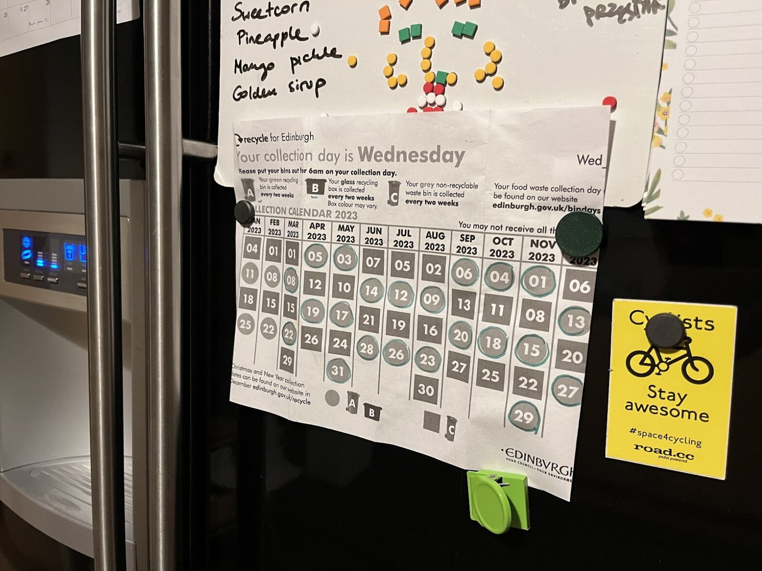 photo of a recycling calendar attached to a fridge door